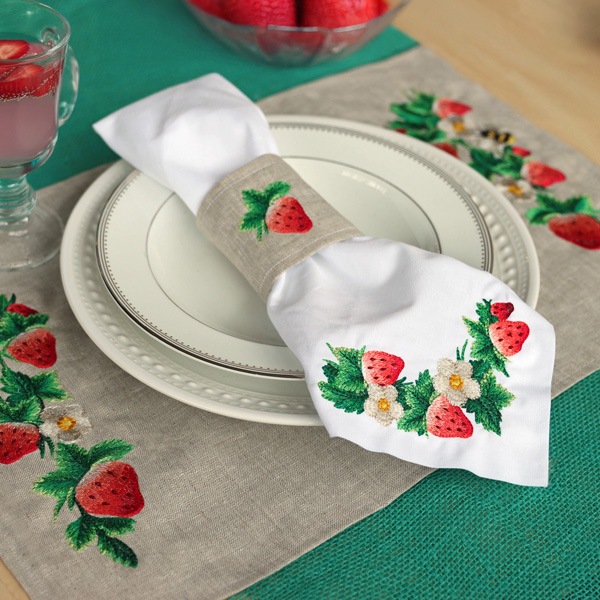 Homespun Stitches - Image Features strawberry machine embroidery designs stitched onto a place setting